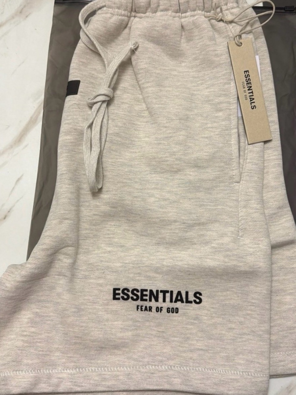 Fear of God ESSENTIALS Light Oatmeal Shorts